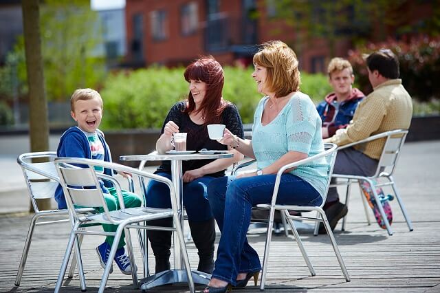 Family sat at ourdoor table