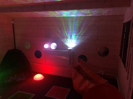 Sensory room with pink lights